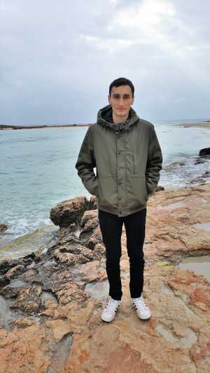 Claudiu Popa on a rocky beach